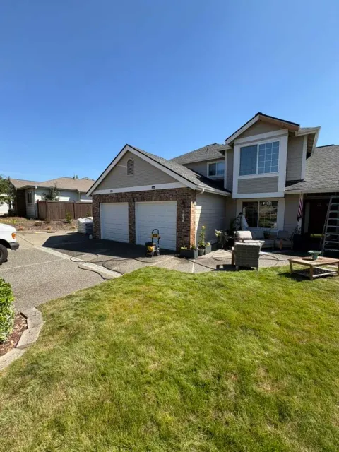 Front garage and entry elevation before exterior painting in Silverdale