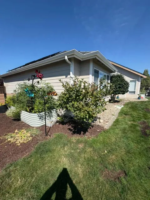 Side elevation with neutral siding before exterior repainting