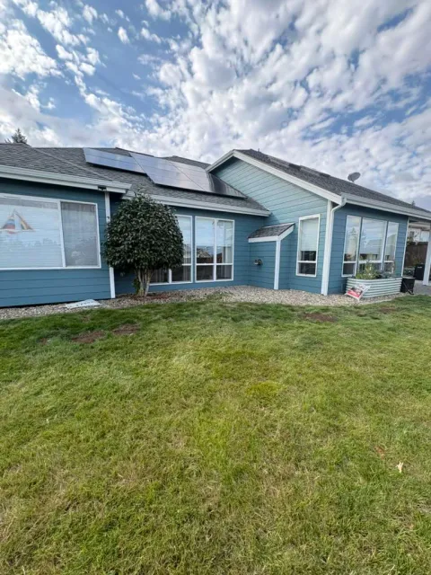 Finished blue rear elevation with white trim on a Silverdale home