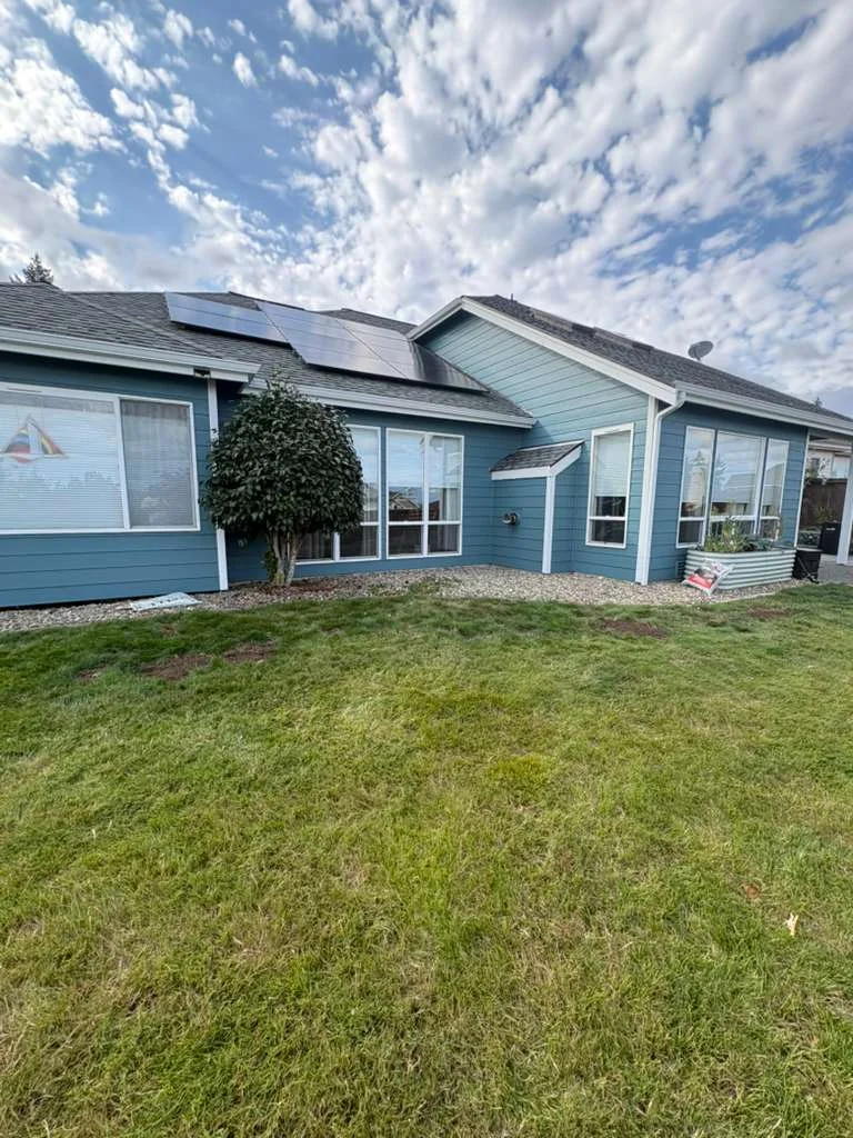 Finished blue rear elevation with white trim on a Silverdale home