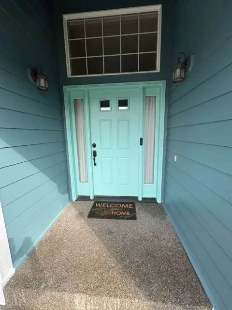 Finished blue front entry with coordinated door and trim paint
