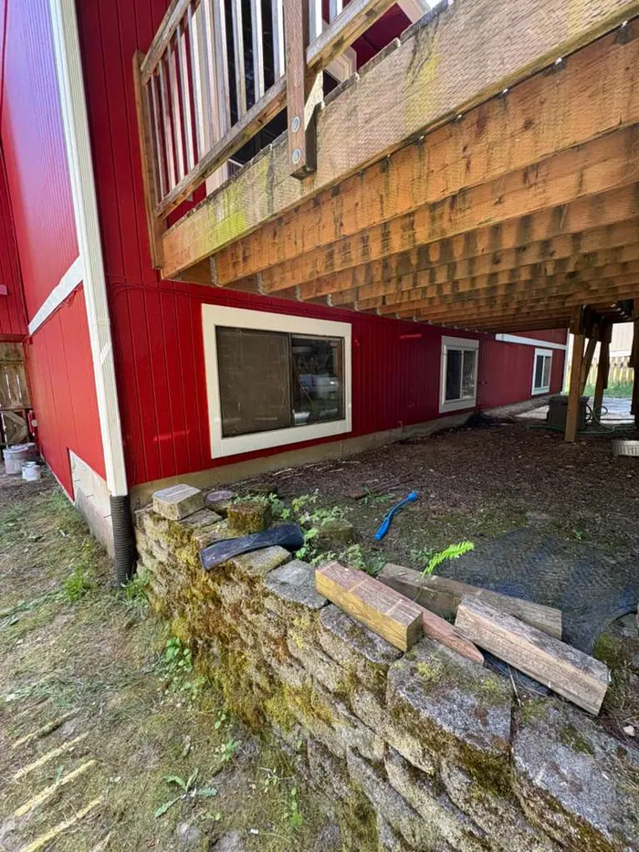 Finished under-deck exterior siding detail with masonry edge